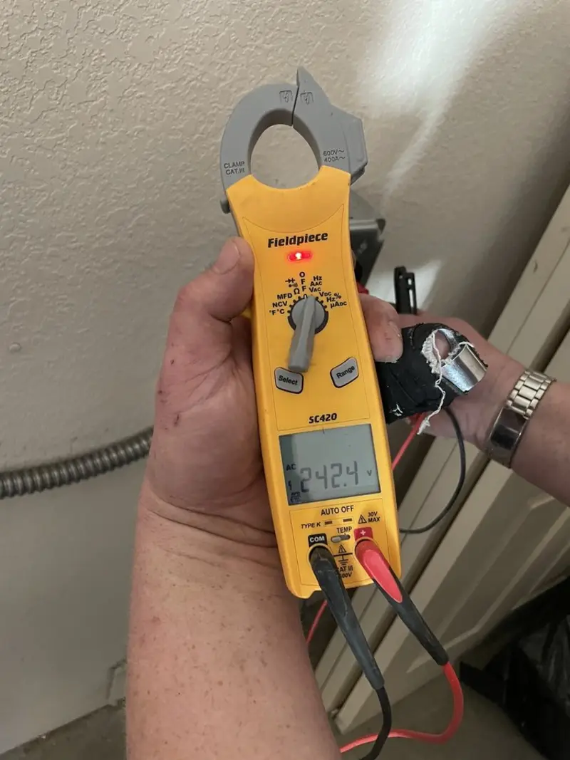 Voltage testing with clamp meter during Electrical Installation Services in Neenah